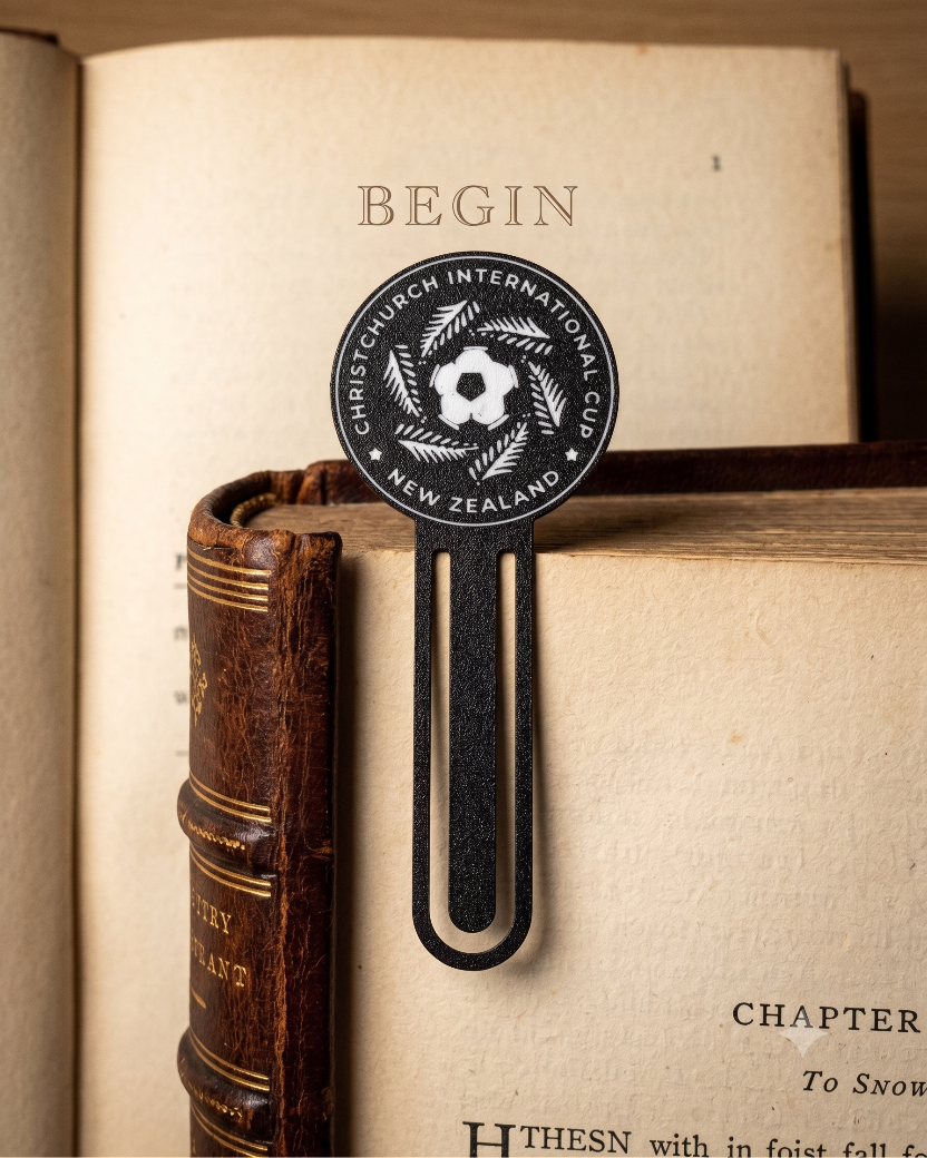 Bookmark with Christchurch International Cup logo on an open book