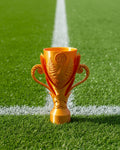 Gold trophy with intricate design on a white background