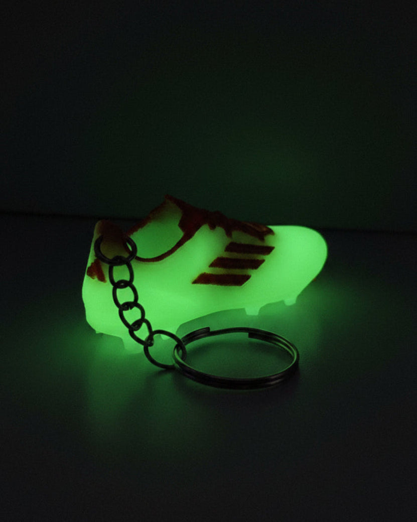 Keychain with a green and brown design on a white background