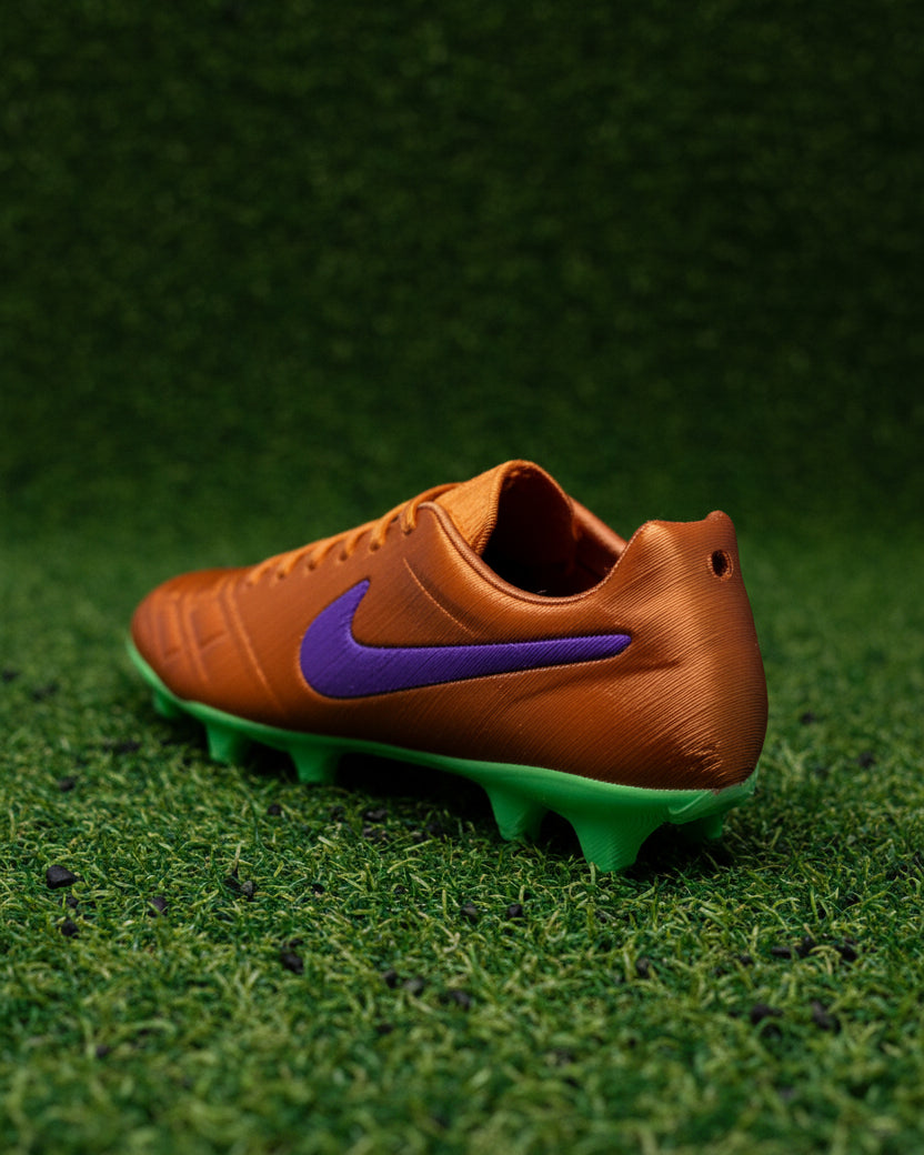 Brown shoe with a purple logo on a white background