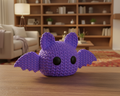 Purple bat-shaped toy on a black background