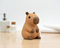 Brown plush toy hippo on a white background