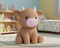 Crocheted bull toy on a light gray background