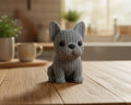 Gray crochet dog toy on a white background