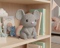 Gray knitted mouse toy on a light gray background