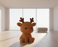Knitted reindeer toy on a light gray background